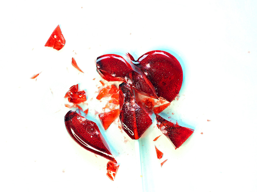 Broken heart drawing on white background