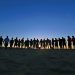People lined up on a horizon