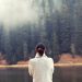 Woman looking at a river and landscape