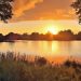 Beautiful and romantic sunset at a lake in yellow and orange colors