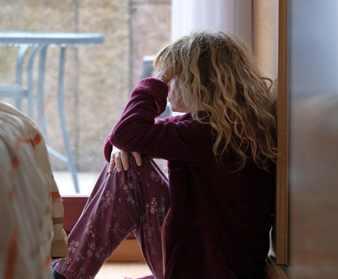 woman at home with depression, loneliness, or sadness