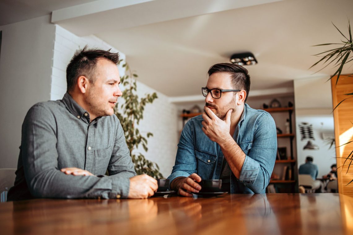 Two men talking