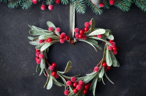 Heart-shaped mistletoe in a Christmas wreath