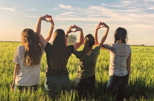 A group of young ladies standing together