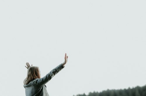 A woman worshiping God outside