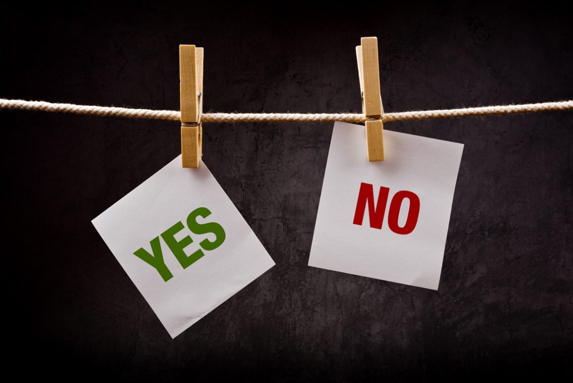 "Yes" and "No" printed on two pieces of paper