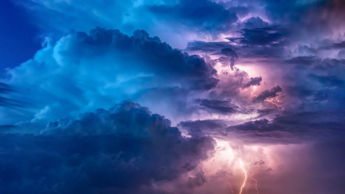 Blue and purple storm clouds with lightning