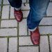 View of a man's shoes as he steps forward