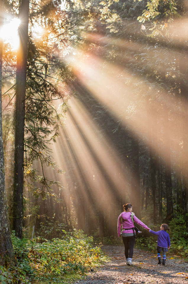 Mom and daughter walk in the woods