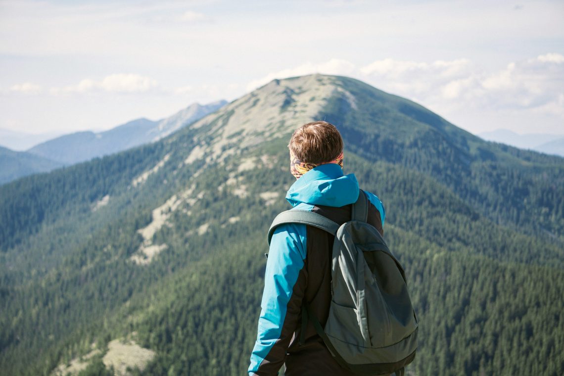 Mountain climber looking at the next summit