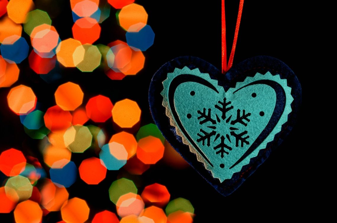 Heart Ornament in front of Christmas Lights