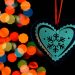 Heart Ornament in front of Christmas Lights