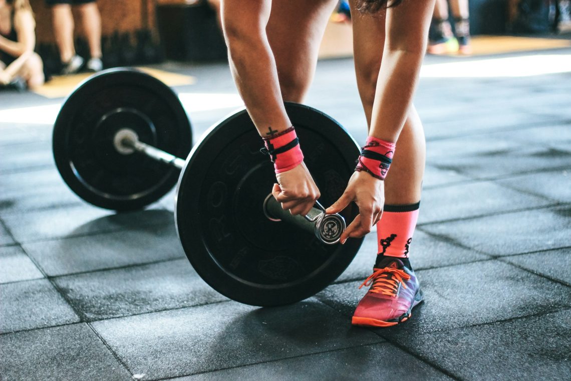 A woman preparing to lift weights