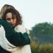 A sad woman hugging a friend