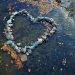 A heart made out of rocks in a creek