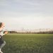 Little girl running in a field