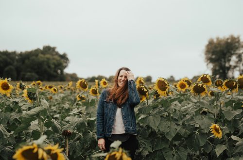 Woman standing in a sunflower field