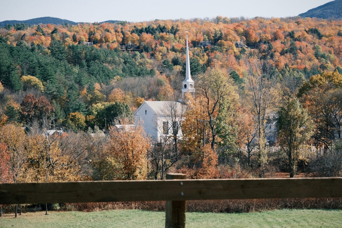 White church in the hills in autumn