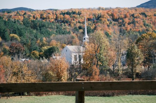 White church in the hills in autumn