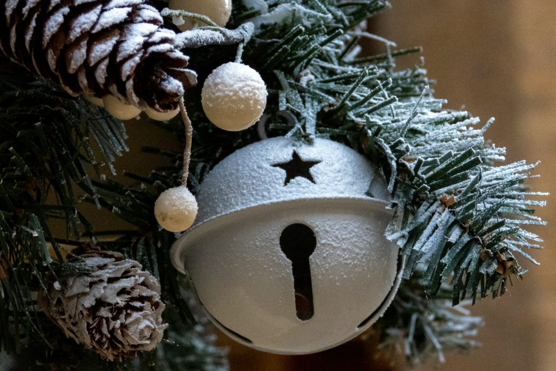 White Christmas bell on Christmas tree