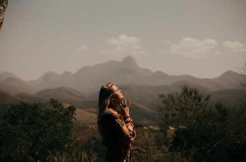 Woman praying in the mountains