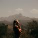 Woman praying in the mountains