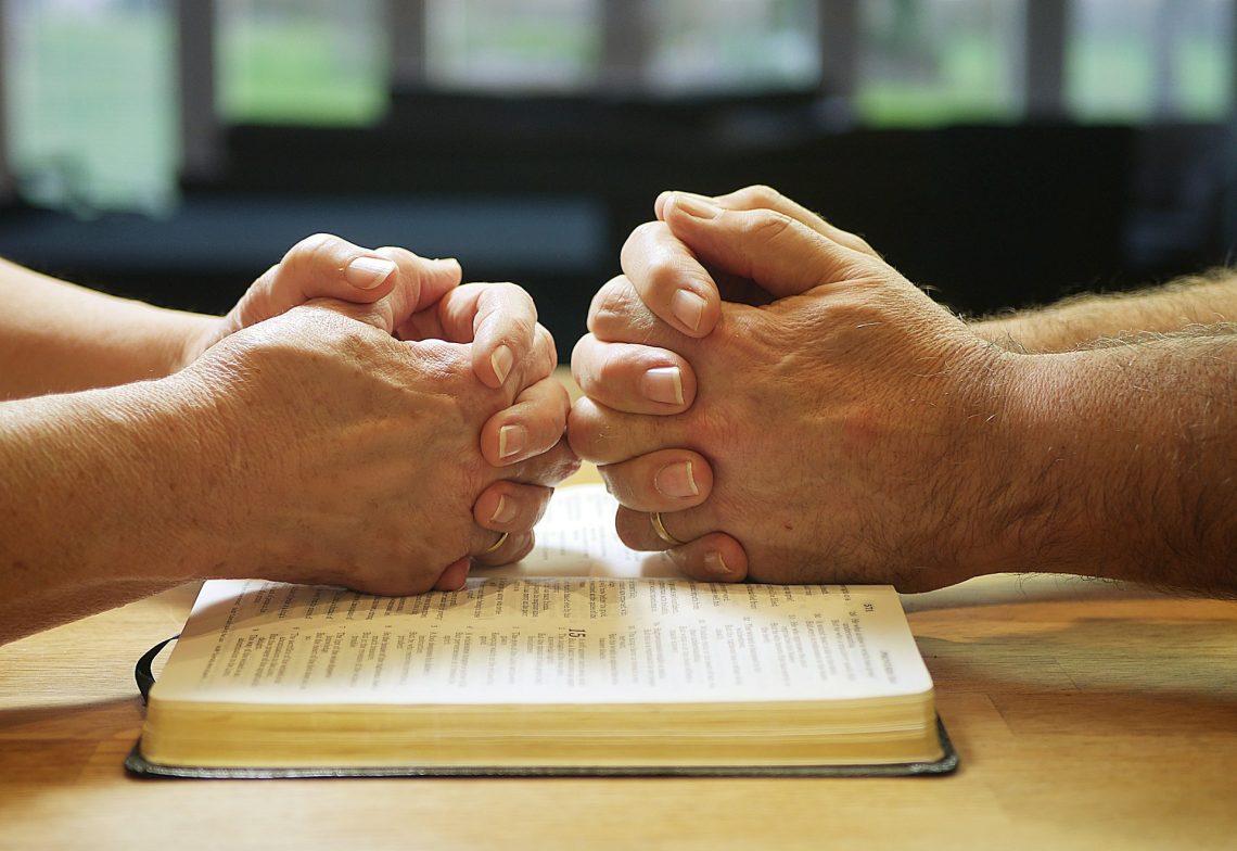 Two people praying
