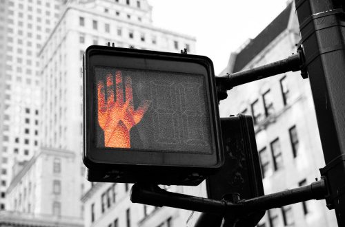 Pedestrian crosswalk light showing a don't walk sign