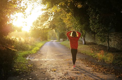 Lady walking on road in the morning